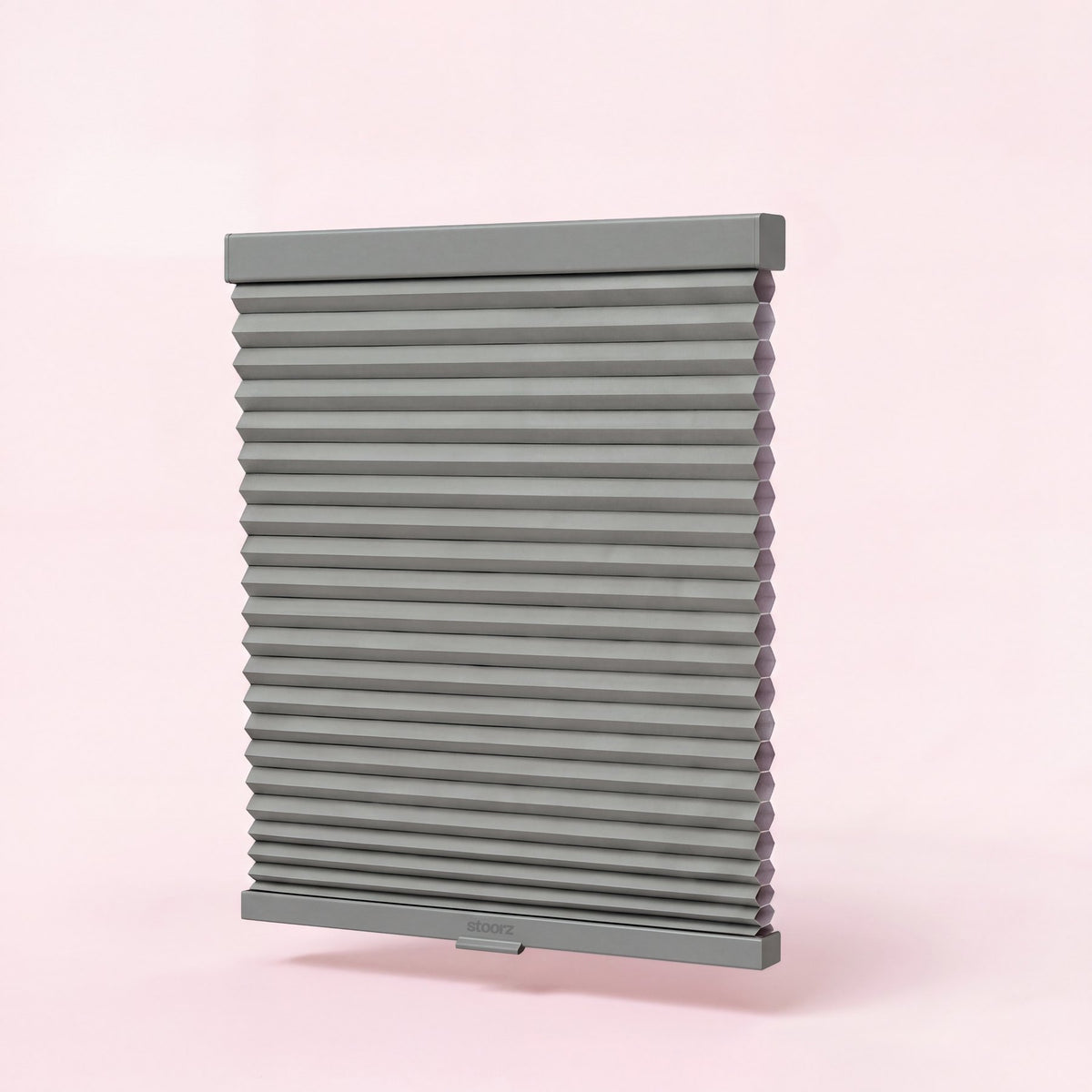 Stoorz blind with its aluminium rail and adhesive strip, its pleated fabric and its bottom bar with clip-on handle